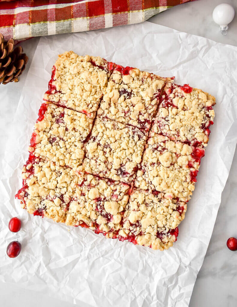 Sliced Cranberry Bars on parchment paper