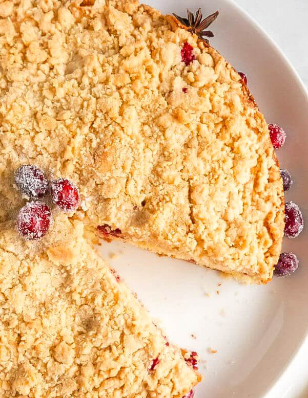 Sliced Cranberry Orange Streusel Cake with sugared cranberries