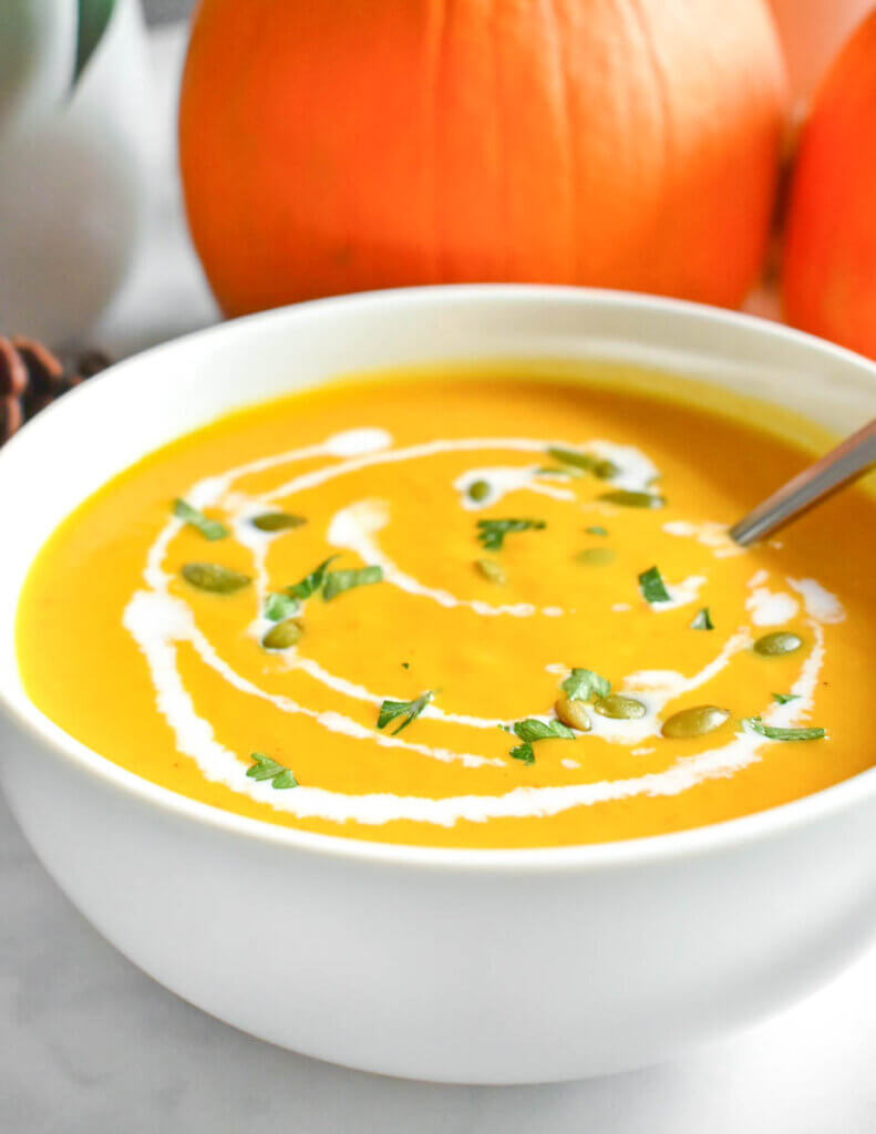 Bowl of Creamy Pumpkin Soup with pumpkin seeds