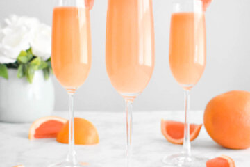 grapefruit mimosa cocktails in champagne flutes