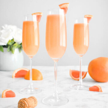 grapefruit mimosa cocktails in champagne flutes