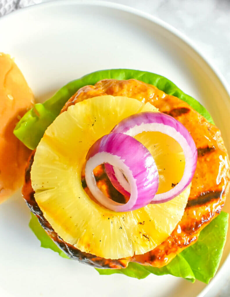 Hawaiian Turkey Burger topped with grilled pineapple and red onion