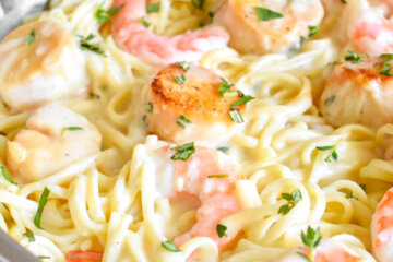 Close up of Lightened Up Creamy Seafood Pasta with seared scallops and shrimp