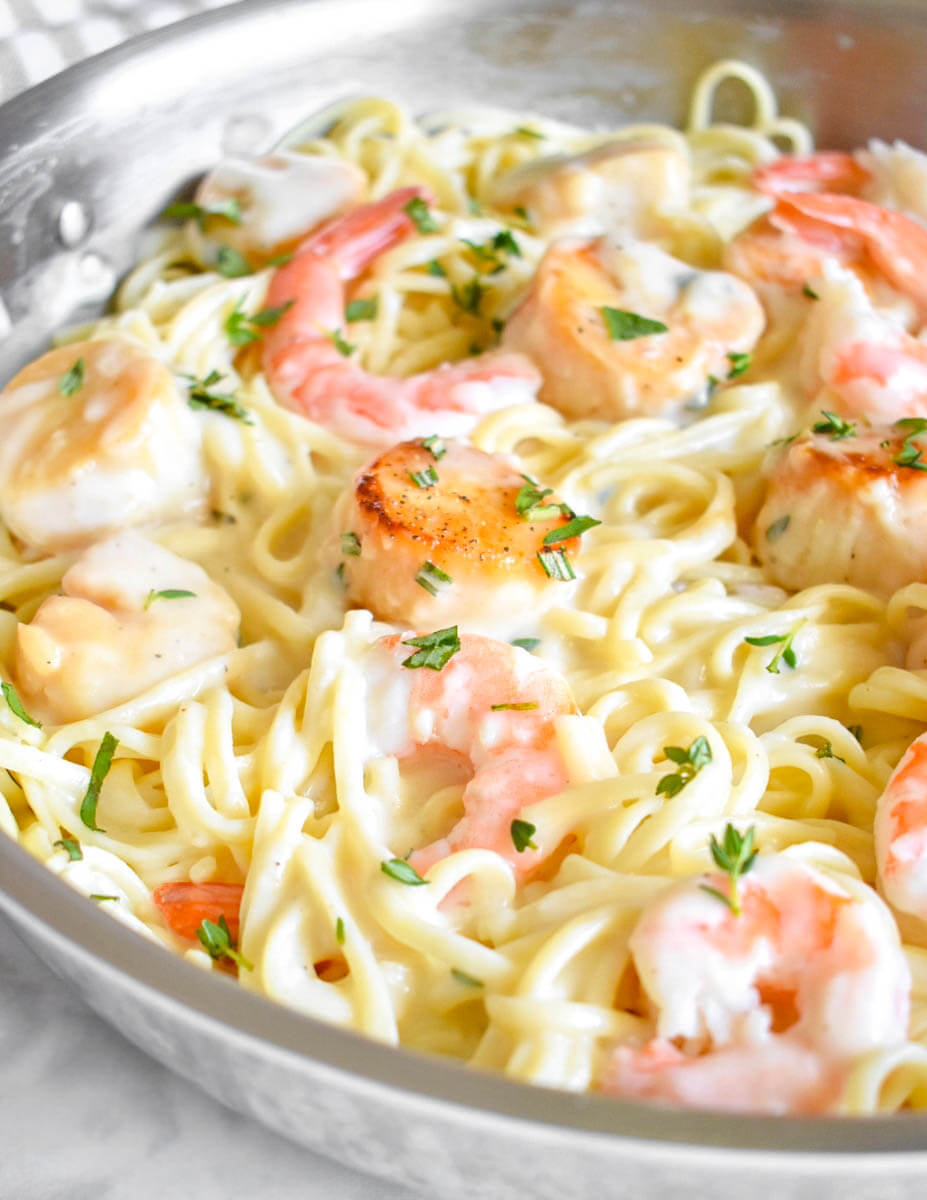 Close up of Lightened Up Creamy Seafood Pasta with seared scallops and shrimp