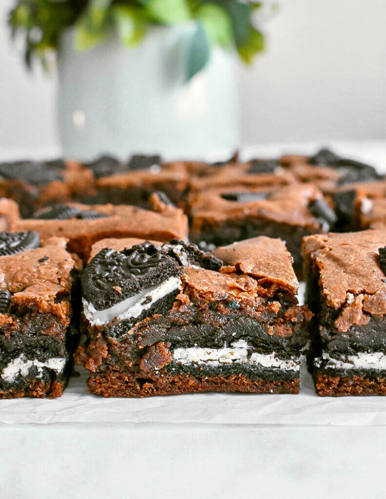 Sliced Oreo Brownies on parchment paper