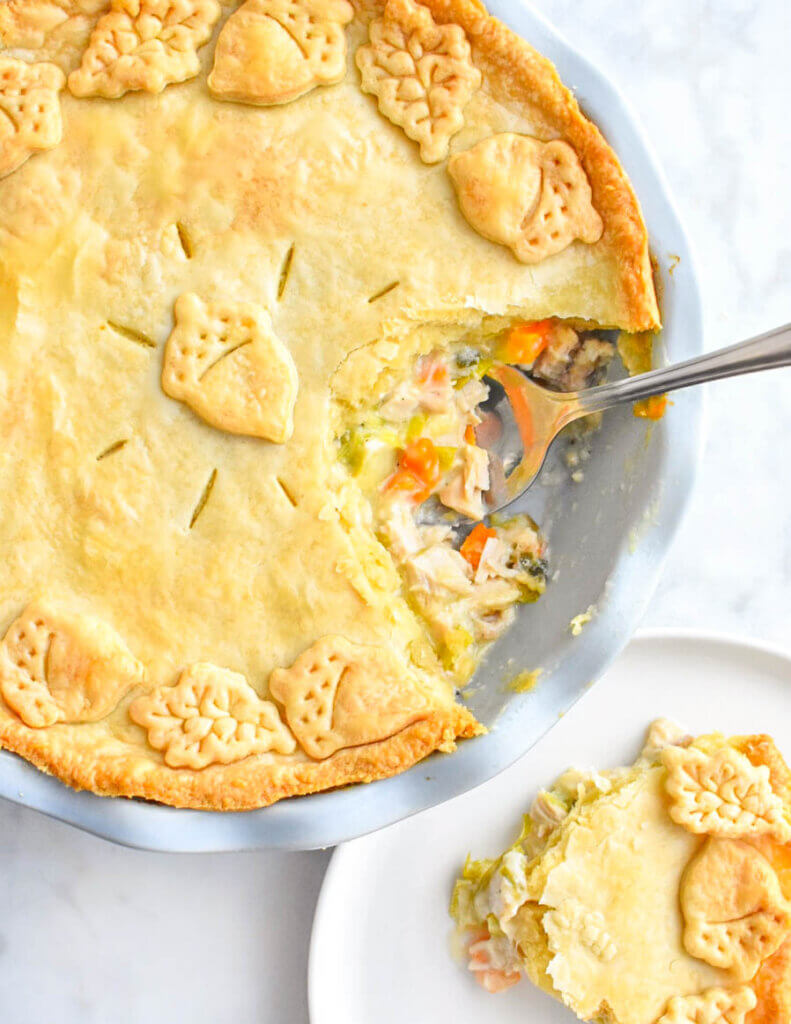 Turkey and Leek Pie sliced with a creamy filling of turkey and vegetables