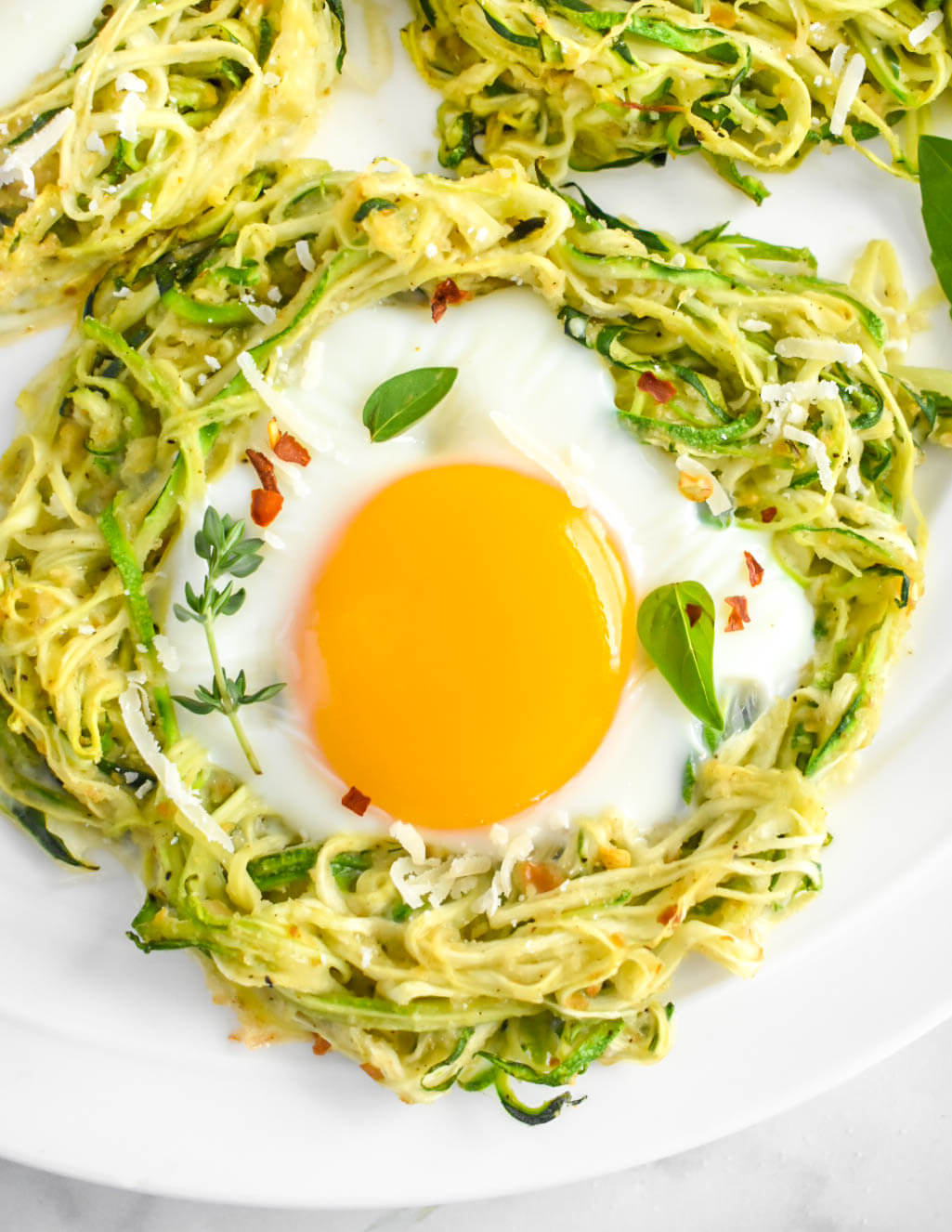 Zucchini Egg Nest topped with fresh herbs