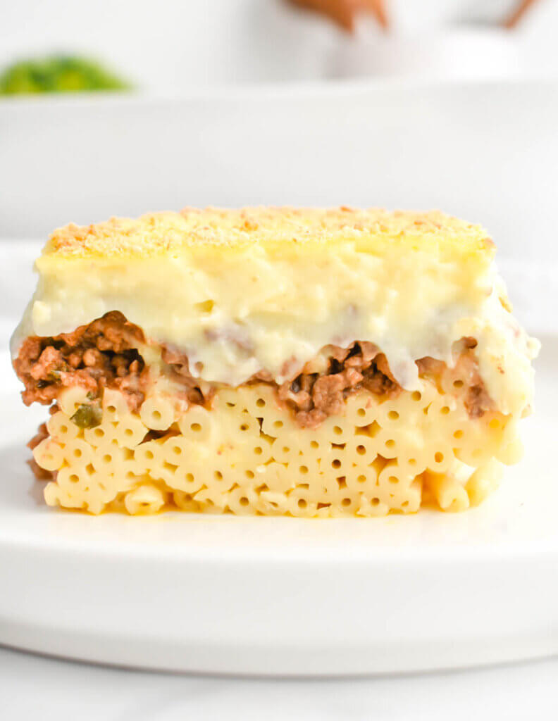 A slice of Pastitsio on a white plate.