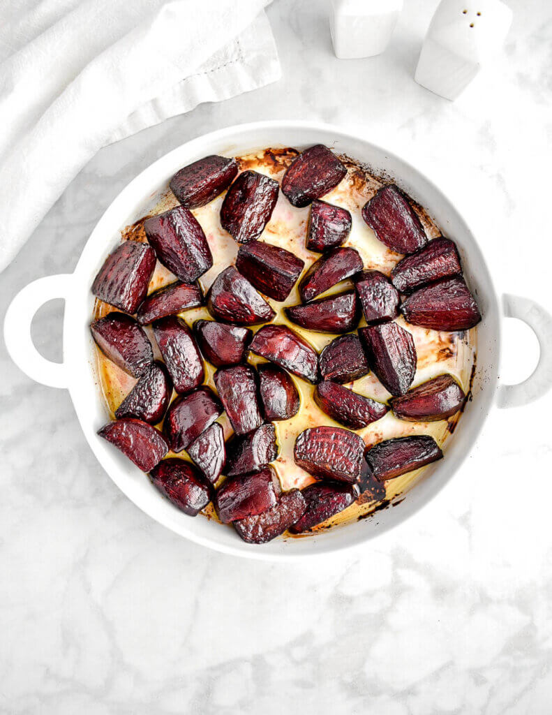 Roasted beets in a round baking dish.