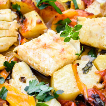 Cod, potatoes, tomatoes, and peppers baked in olive oil and tomato sauce.