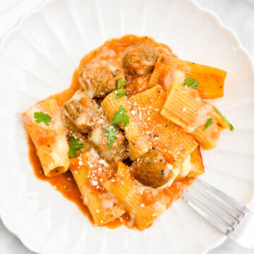 Meatball Pasta Bake on a white scalloped plate.