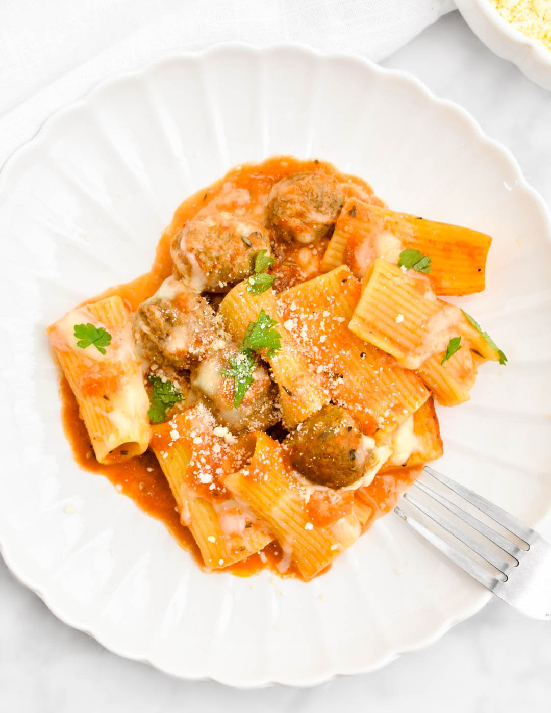 Meatball Pasta Bake on a white scalloped plate.