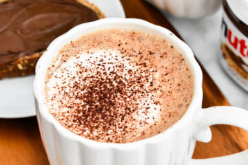 A Nutella Latte dusted with cocoa powder.