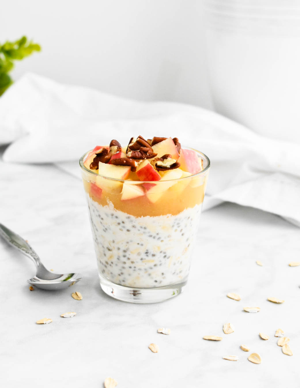 Overnight oats topped with apple sauce, chopped apples and pecans.